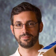 Craig Hardgrove holding the LunaH-Map spacecraft